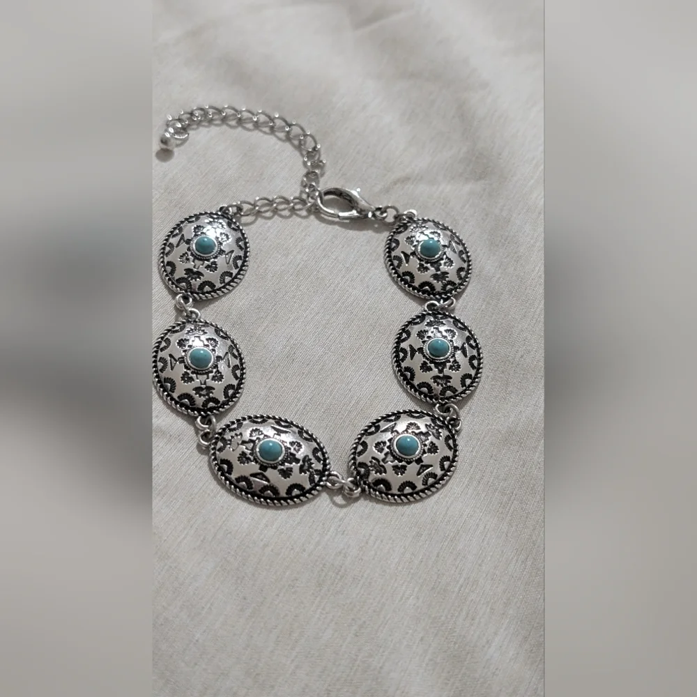 Intricate Silver Bracelet with Turquoise Accents